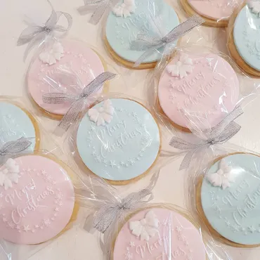 White and grey Easter bunny iced biscuits with floral crown and heart designs