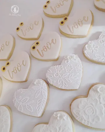 Jungle animal round iced biscuits with monkey, tiger, elephant, tropical leaf and Liam name designs