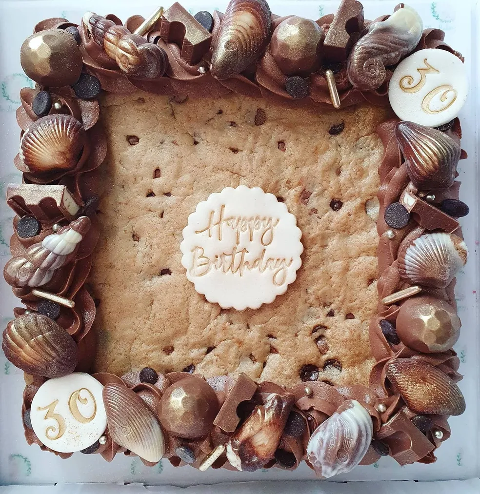 Cookie slab with chocolate buttercream, gold shell chocolates and Happy Birthday 30 topper