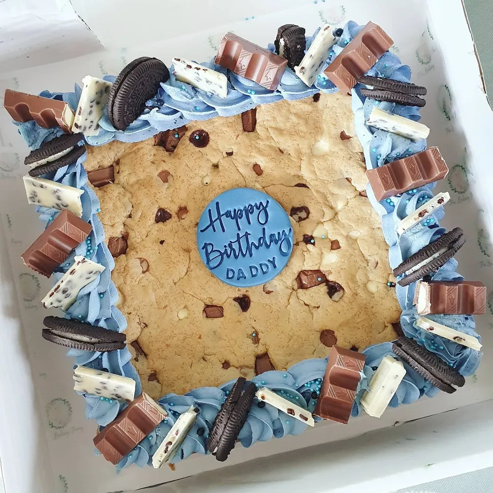 Cookie slab with blue buttercream, Oreos and chocolate bars with Happy Birthday Daddy topper